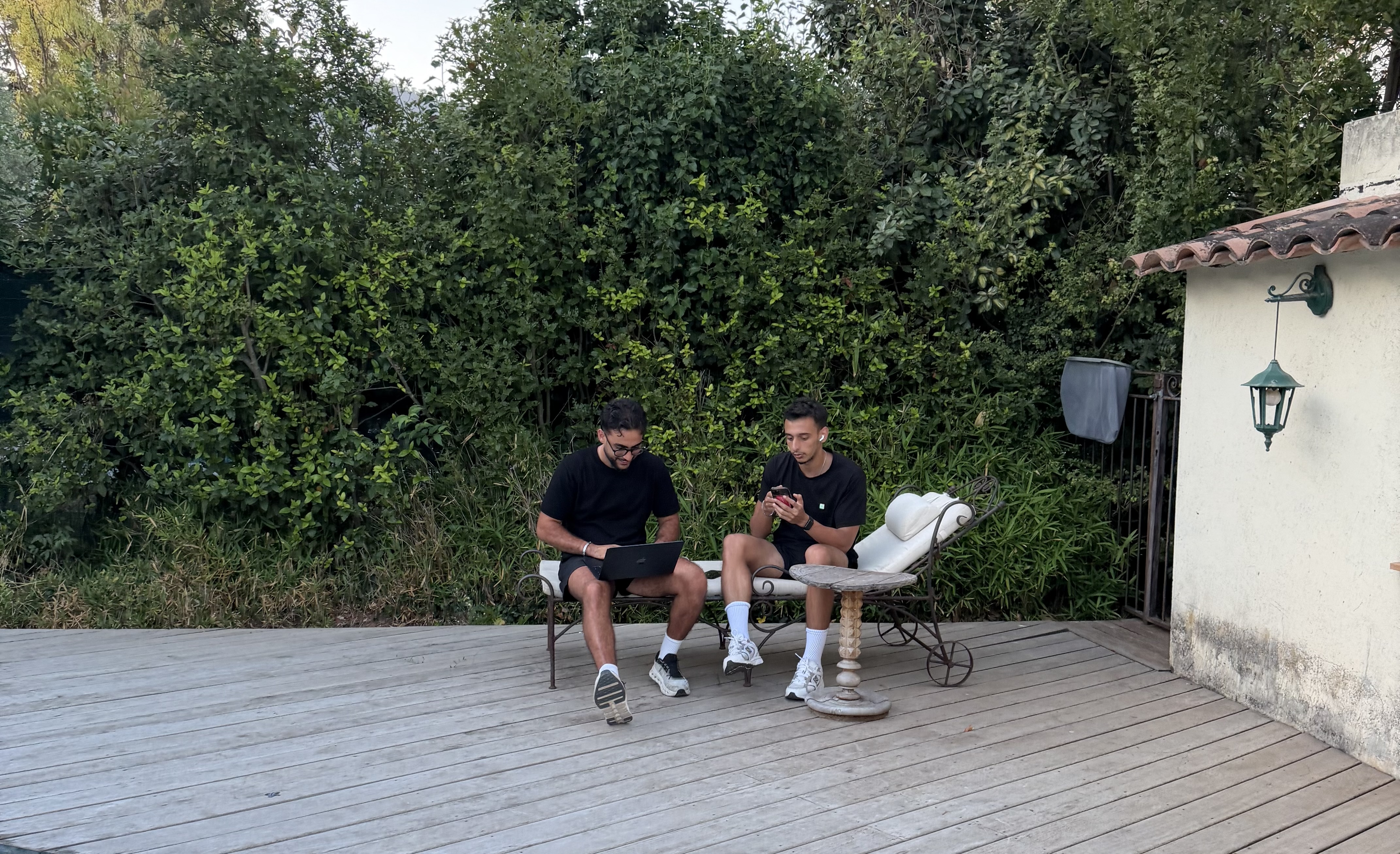 Marouane Boubia and Omar Harradi working together outdoors